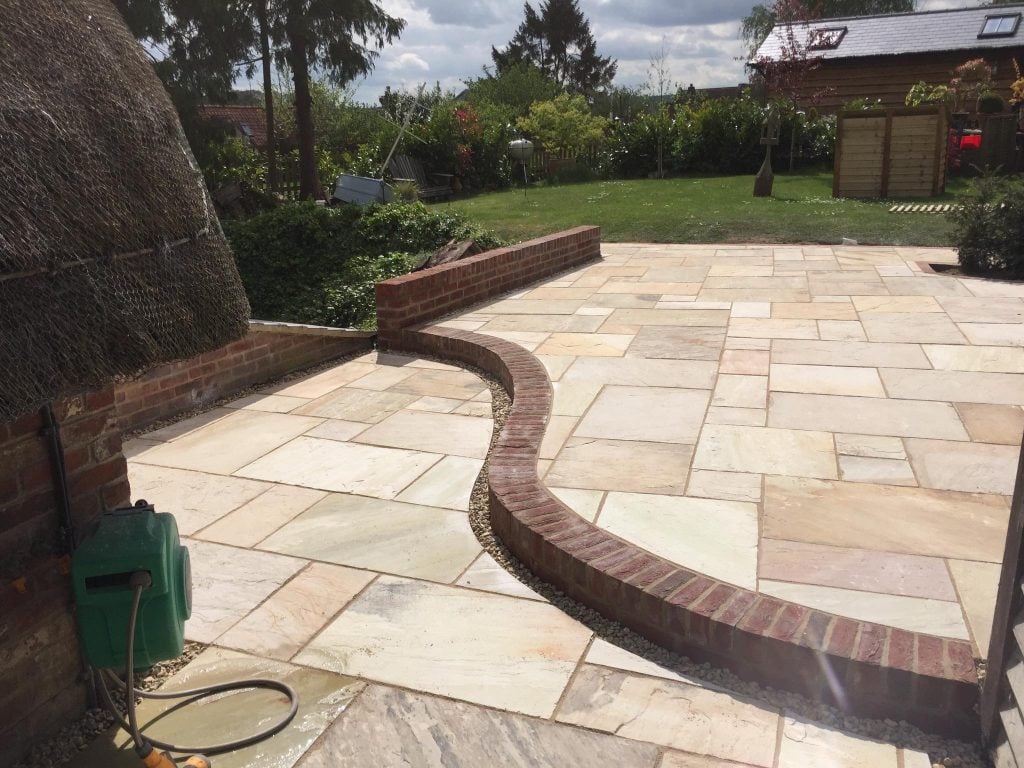 stone paving completed with grass and shrubs, Turfing, Landscaping design, paving and walls, decking, block paving and driveway, planting, ponds and water features, gates and fences, garden sheds, patios and terraces in Calne, Devizes